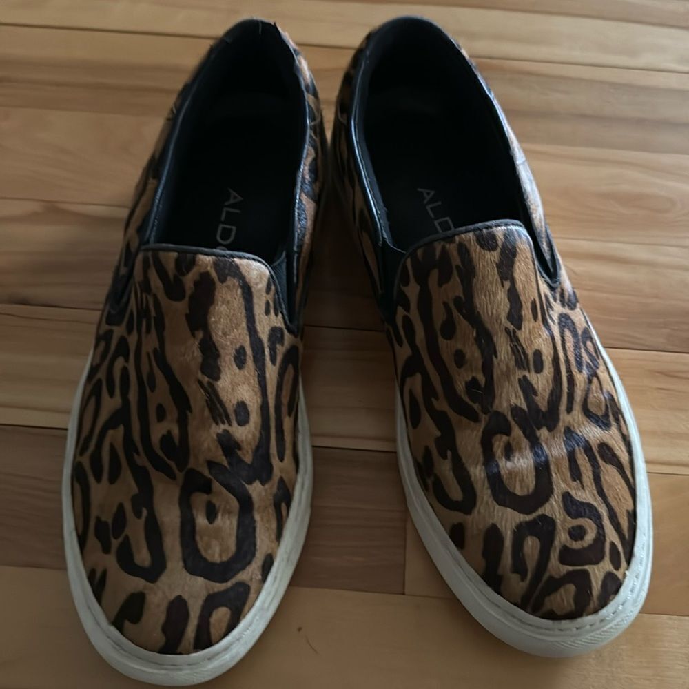 Aldo calf hair leopard print slip on sneakers. White bumpers. Size 8 1/2. Flaws.